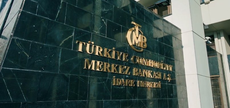 TURKEY’S CENTRAL BANK LOWERS LIRA-TO-DOLLAR RATE, INFLATION FORECASTS