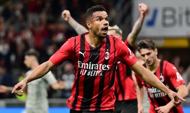Milan return to top of Serie A with battling victory over Genoa