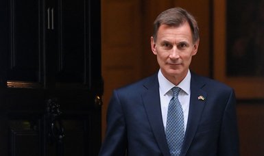 UK's Hunt: Spending cuts now would worsen recession