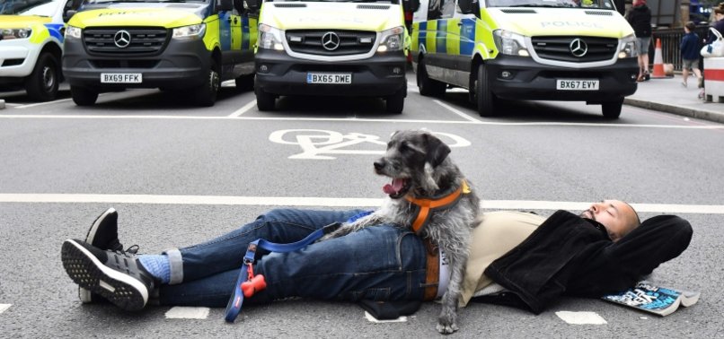 CLIMATE PROTESTERS ARRESTED AS THEY BLOCK ROAD TO BUSY LONDON BRIDGE