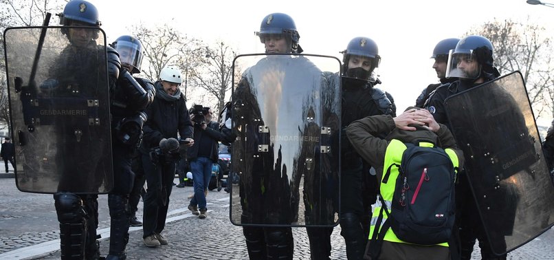 ALMOST 700 DETAINED AS YELLOW VEST PROTESTERS GATHER IN PARIS