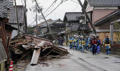 Japan quake death toll rises to 64, people still trapped inside collapsed buildings