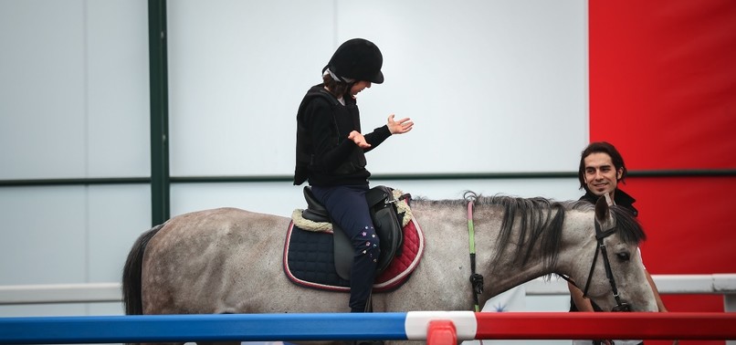 HORSE THERAPY OFFERS DISABLED CHILDREN NEW FORM OF REHABILITATION