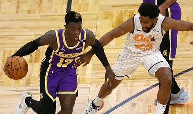 Lakers end losing skid, outlast Magic