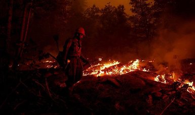 Huge California wildfire grows, but weather helps firefighters