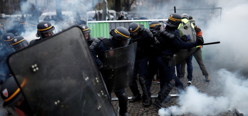 FRANCE DETAINS AT LEAST 100 IN PARIS FUEL PRICE PROTESTS
