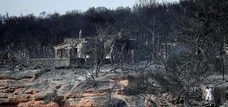 Greece fire contained a year after blaze killed at least 100