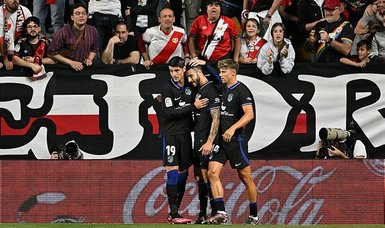 Atletico win at Rayo Vallecano to close in on second-placed Real