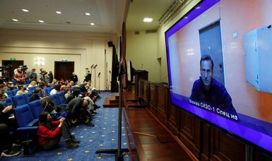 Russian court rules that Kremlin critic Navalny must stay in jail