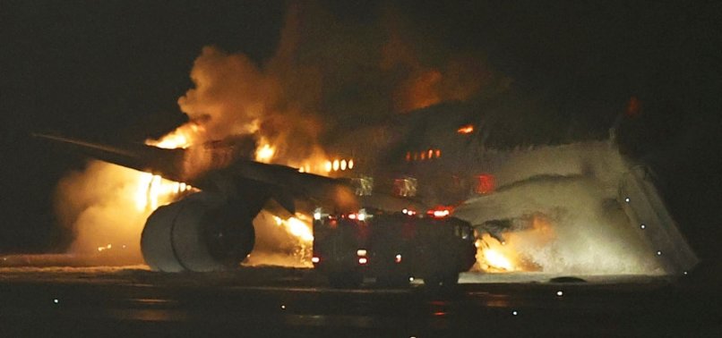 JAPAN EVACUATES 400 PASSENGERS FROM PLANE CAUGHT IN FIRE AT TOKYO AIRPORT