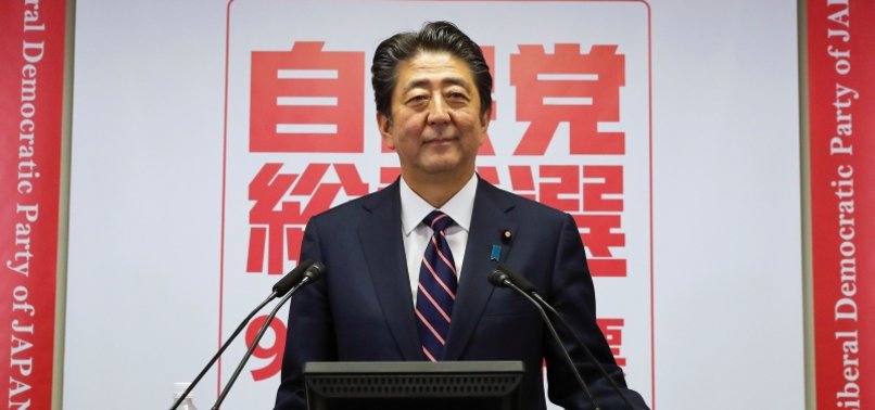 JAPANS ABE RE-ELECTED AS RULING PARTY LEADER, TO STAY ON AS PM