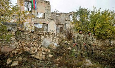 Azerbaijani soldiers help Armenian civilians evacuate