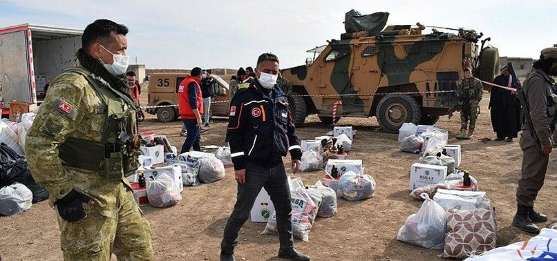 TURKISH SOLDIERS DISTRIBUTE AID TO NEEDY SYRIAN PEOPLE IN TERROR-FREE REGION