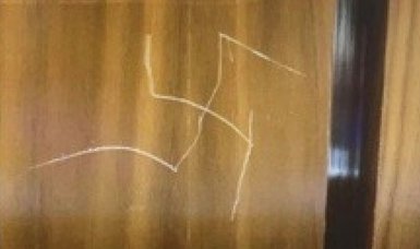U.S. State Department to investigate swastika carved into elevator