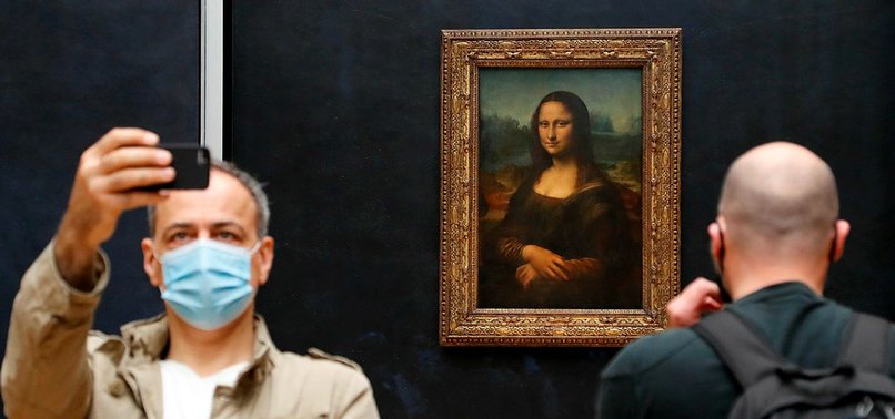 MONA LISA BACK AT WORK, VISITORS LIMITED AS LOUVRE REOPENS