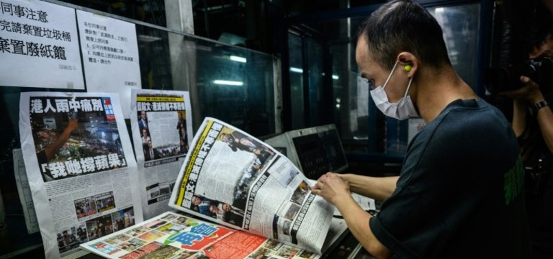 HONG KONGERS SNAP UP FINAL EDITION OF APPLE DAILY NEWSPAPER