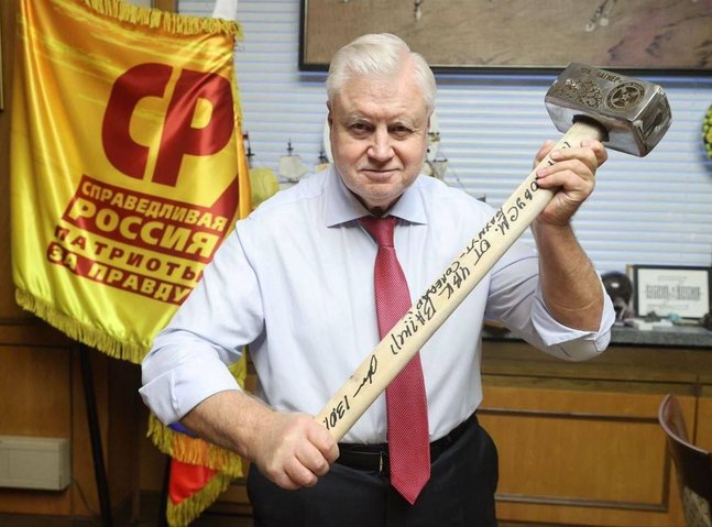 Russian politician Sergei Mironov poses with sledgehammer in tribute to Wagner mercenaries