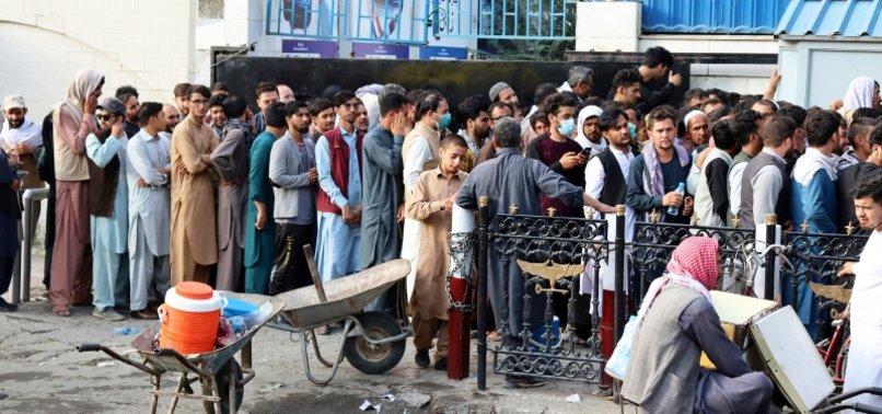 PEOPLE THRONG BANKS IN KABUL, PRESSING TO GET CASH