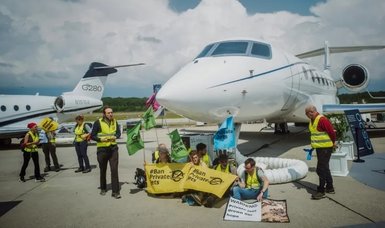 Greenpeace activists disrupt air traffic at Geneva airport