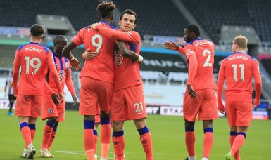 Chelsea go top with win at Newcastle