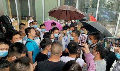 Protests as Chinese property giant Evergrande faces 'tremendous pressure'