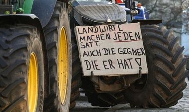 Burning tyres, dumped manure: German farmers continue protests