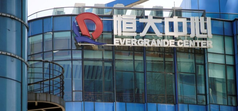 CHINA EVERGRANDE SAYS DIRECTORS FELL BELOW STANDARDS IN PROPERTY UNIT PROBE