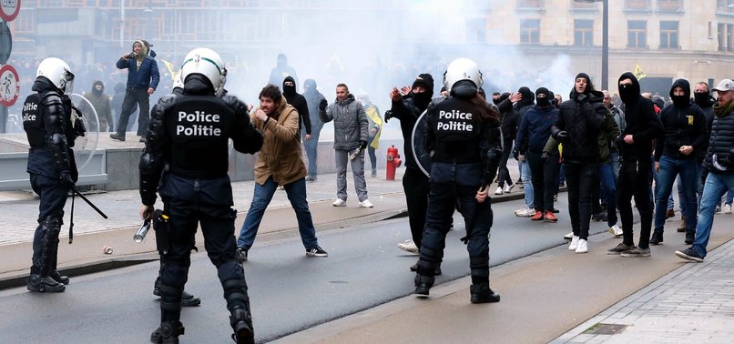 POLICE, ANTI-MIGRATION PROTESTERS CLASH AT EU HEADQUARTERS