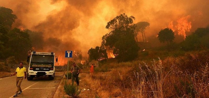 HUNDREDS OF TOURISTS EVACUATED FROM SICILY RESORT THREATENED BY FIRE