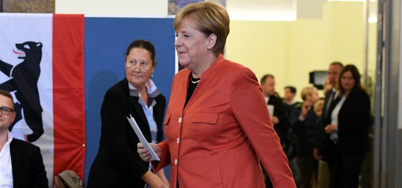 MERKEL BIDS FOR FOURTH TERM AS GERMANS HEAD TO THE POLLS