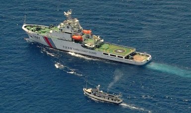 Chinese ship fires water cannon at Philippine vessels in S China Sea