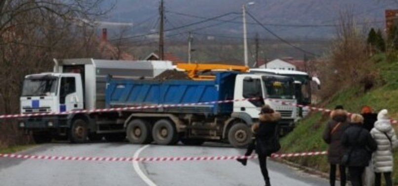 Group of Serbs block roads leading to Kosovos borders demanding ...