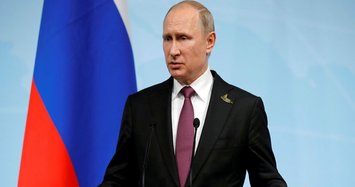 Putin says 755 US diplomats must leave Russia in retaliation for new US sanctions