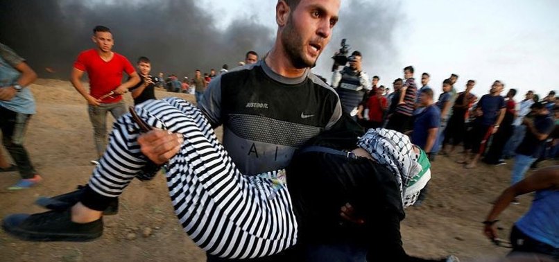 DOZENS OF PALESTINIANS WOUNDED BY ISRAELI FIRE AT GAZA BORDER