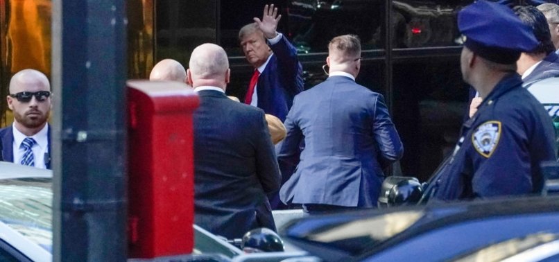 TRUMP ARRIVES AT TRUMP TOWER ON EVE OF HISTORIC ARRAIGNMENT