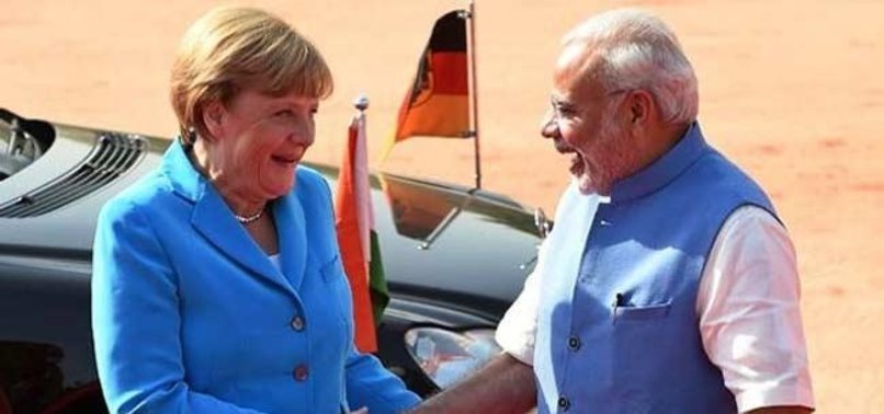 MERKEL AND MODI CALL FOR COOPERATION AFTER US CLIMATE IMPASSE AT G7