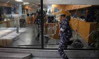Armed woman break into Beirut bank to withdraw savings to treat sick sister