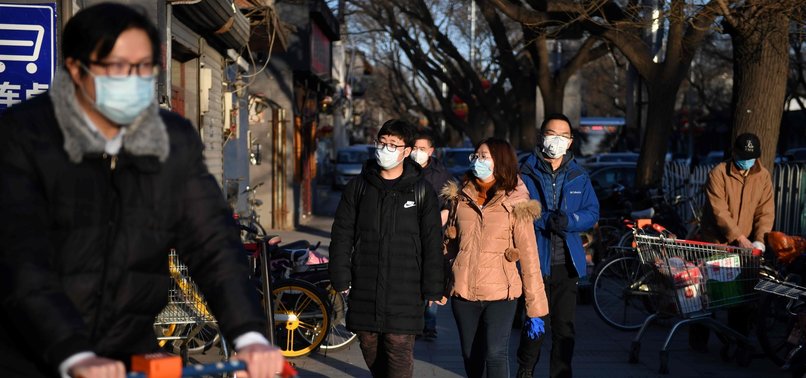 NEW VIRUS CASES IN CHINA FALL AGAIN AS DEATHS TOP 2,000