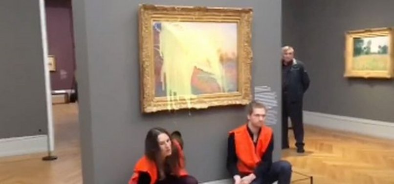 CLIMATE ACTIVISTS HURL MASHED POTATOES AT MONET PAINTING IN GERMANY