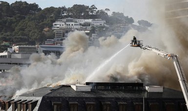 Firefighters battle new blaze at South African parliament, suspect charged with arson