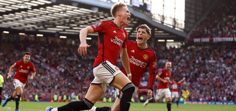 MCTOMINAY STRIKES TWICE IN STOPPAGE TIME TO SNATCH A 2-1 WIN FOR MAN UNITED OVER BRENTFORD