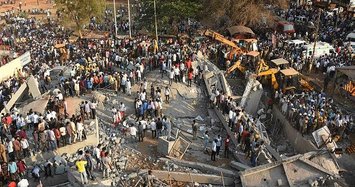 Two dead, dozens trapped, in India building collapse