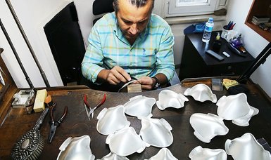 Turkish craftsman forges unique silver, gold facemasks
