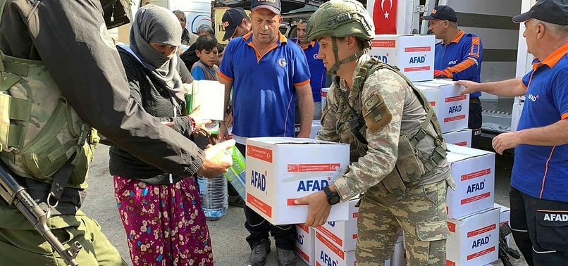 TURKISH TROOPS HAND OUT HUMANITARIAN AID TO NEEDY RAS AL-AYN RESIDENTS