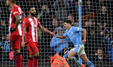 Manchester City cap epic year with 2-0 home win over Sheffield United
