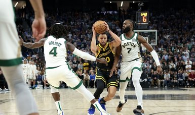 Stephen Curry, Warriors put Celtics to rest in OT