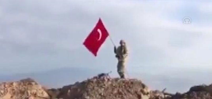 COMMANDOS RAISE TURKISH FLAG ON LIBERATED MOUNT DARMIQ