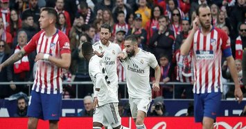 Real win Madrid derby to muscle into title race