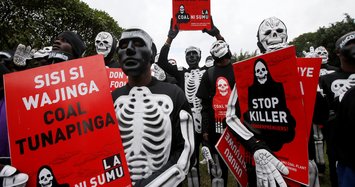 Skeletons walk streets in Kenya to protest coal mining