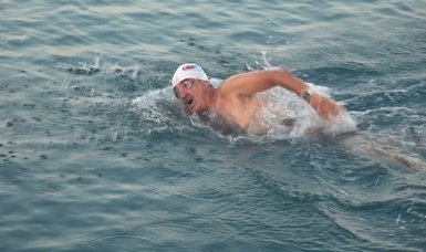 Athletes swim from Turkey to TRNC to mark anniversary of Cyprus peace op